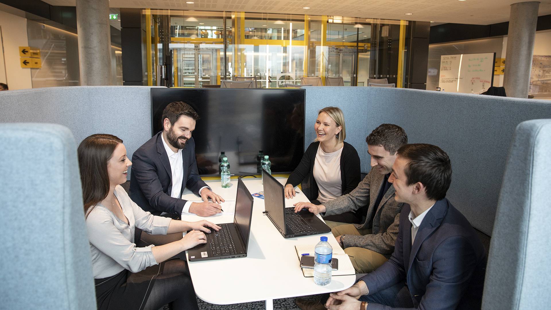 Office - Group of people in huddle space