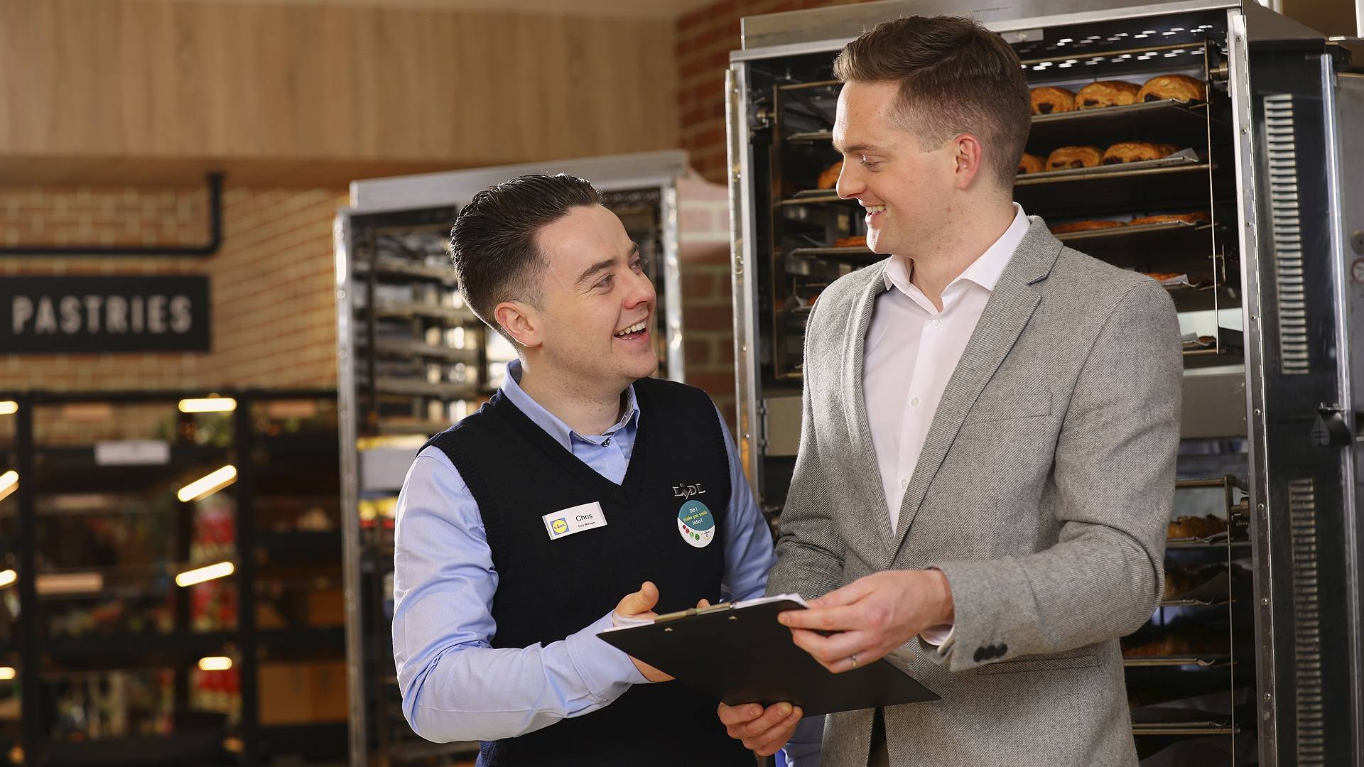Store - SM and SOM talking in bakery